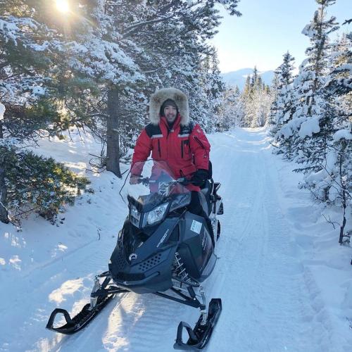 snowmobiling-winter-forest