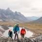 3 people hike in the tombstone mountains